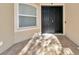 Inviting front entrance with double doors and a tiled entryway at 3970 Serenity Cir, Sarasota, FL 34235