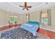 Large Primary bedroom with hardwood floors and ceiling fan at 3970 Serenity Cir, Sarasota, FL 34235