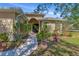 House exterior with a walkway leading to the front door and landscaping at 3970 Serenity Cir, Sarasota, FL 34235