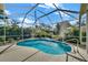 Inviting kidney-shaped pool with screened enclosure at 403 Bow Ln, Bradenton, FL 34208