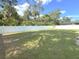 Large grassy backyard with a white fence at 4121 Durant St, Port Charlotte, FL 33948