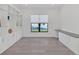 Bright home office with built-in shelving and hardwood floors at 5058 Surfside Cir, Lakewood Ranch, FL 34211