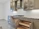 Kitchen featuring stainless steel appliances, granite countertops, and custom pull-out drawers at 5058 Surfside Cir, Lakewood Ranch, FL 34211