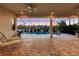 Covered patio overlooking a tranquil pool at 5058 Surfside Cir, Lakewood Ranch, FL 34211