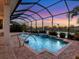 Screened pool and spa with sunset view at 5058 Surfside Cir, Lakewood Ranch, FL 34211