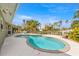 Large kidney-shaped pool with canal views and patio at 506 71St St, Holmes Beach, FL 34217