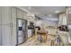 Modern kitchen with granite counters, white cabinets, and stainless steel appliances at 560 Oakford Rd, Sarasota, FL 34240