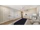 Bright bedroom with ceiling fan, double doors, and wood-look tile flooring at 5760 Midnight Pass Rd # 307D, Sarasota, FL 34242