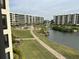 Aerial view of resort-style community with pool and landscaping at 5760 Midnight Pass Rd # 307D, Sarasota, FL 34242