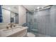Modern bathroom with a glass-enclosed shower and stylish tile at 5760 Midnight Pass Rd # 307D, Sarasota, FL 34242