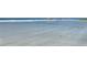 Scenic beach view with calm water and white sand at 5760 Midnight Pass Rd # 307D, Sarasota, FL 34242