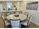 Bright dining area open to kitchen with seating for six at 5760 Midnight Pass Rd # 307D, Sarasota, FL 34242