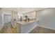 Updated kitchen with breakfast bar and stainless steel appliances at 5760 Midnight Pass Rd # 307D, Sarasota, FL 34242