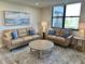 Living room features two sofas and a window at 5760 Midnight Pass Rd # 307D, Sarasota, FL 34242