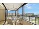 Private balcony with outdoor furniture and scenic views at 5760 Midnight Pass Rd # 307D, Sarasota, FL 34242