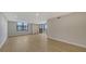 Spacious living room with tile floors and access to balcony at 5760 Midnight Pass Rd # 307D, Sarasota, FL 34242