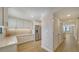 Modern kitchen with white cabinets, stainless steel appliances, and tile backsplash at 5760 Midnight Pass Rd # 307D, Sarasota, FL 34242