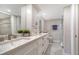 Elegant bathroom with double vanity, granite countertop, and a walk-in shower at 5760 Midnight Pass Rd # 307D, Sarasota, FL 34242