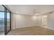 Bright bedroom with tile floors and access to bathroom at 5760 Midnight Pass Rd # 307D, Sarasota, FL 34242