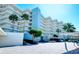 Attractive building exterior with ample parking and landscaping at 5760 Midnight Pass Rd # 307D, Sarasota, FL 34242