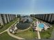 Aerial view of the community including a pond and pool at 5770 Midnight Pass Rd # 705C, Sarasota, FL 34242