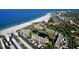 Aerial view of the community featuring condos, landscaping, beach and waterfront at 5770 Midnight Pass Rd # 705C, Sarasota, FL 34242