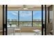 Enjoy the ocean views from this condo's lanai with seating and ceiling fan at 5770 Midnight Pass Rd # 705C, Sarasota, FL 34242