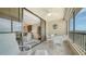 Relax on this condo's lanai with ocean view, ceiling fan, and seating at 5770 Midnight Pass Rd # 705C, Sarasota, FL 34242