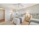 Guest bedroom with two twin beds and a dresser at 5770 Midnight Pass Rd # 705C, Sarasota, FL 34242