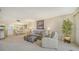 Open-concept living room featuring comfortable seating and adjacent dining area at 5770 Midnight Pass Rd # 705C, Sarasota, FL 34242