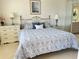 Comfortable main bedroom with matching nightstands and an ensuite bathroom at 5770 Midnight Pass Rd # 705C, Sarasota, FL 34242