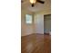 Bright bedroom with wood floors and ceiling fan at 601 27Th W St, Bradenton, FL 34205