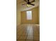 Bright bedroom with tile floors and ceiling fan at 601 27Th W St, Bradenton, FL 34205
