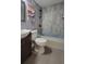 Updated bathroom with bathtub and gray tile at 601 27Th W St, Bradenton, FL 34205