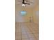 Bright bedroom with tile flooring and ceiling fan at 601 27Th W St, Bradenton, FL 34205