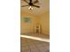 Bright bedroom with tile flooring and ceiling fan at 601 27Th W St, Bradenton, FL 34205