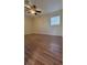 Spacious bedroom with wood-look floors and ceiling fan at 601 27Th W St, Bradenton, FL 34205