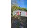 Gray house with red door and small front porch at 601 27Th W St, Bradenton, FL 34205