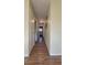 Hallway featuring wood-look floors and access to other rooms at 601 27Th W St, Bradenton, FL 34205