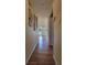 Hallway with wood-look floors, leading to other rooms at 601 27Th W St, Bradenton, FL 34205