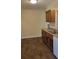Kitchen with wood cabinets and tile floor at 601 27Th W St, Bradenton, FL 34205