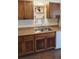 Kitchen with wood cabinets and double sink at 601 27Th W St, Bradenton, FL 34205