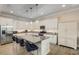 Modern kitchen with white cabinets, an island, and stainless steel appliances at 7725 Sandhill Lake Dr, Sarasota, FL 34241