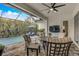 Inviting pool area with patio furniture and screened enclosure at 7725 Sandhill Lake Dr, Sarasota, FL 34241