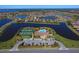 Community overview showcasing the pool, tennis courts, and homes at 7914 Grand Estuary Trl # 102, Bradenton, FL 34212