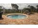 Community hot tub with a relaxing lakeside view at 7914 Grand Estuary Trl # 102, Bradenton, FL 34212