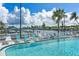 Community pool with lounge chairs and waterfront views at 957 Spanish N Dr, Longboat Key, FL 34228