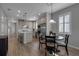 Cozy dining area adjacent to the kitchen with wood-style flooring and natural light at 10610 Spring Tide Way, Parrish, FL 34219