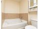 Bathroom with a garden tub and tile surround at 1064 N Tamiami Trl # 1311, Sarasota, FL 34236
