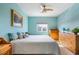 Bedroom with a light blue wall and wooden furniture at 1064 N Tamiami Trl # 1311, Sarasota, FL 34236